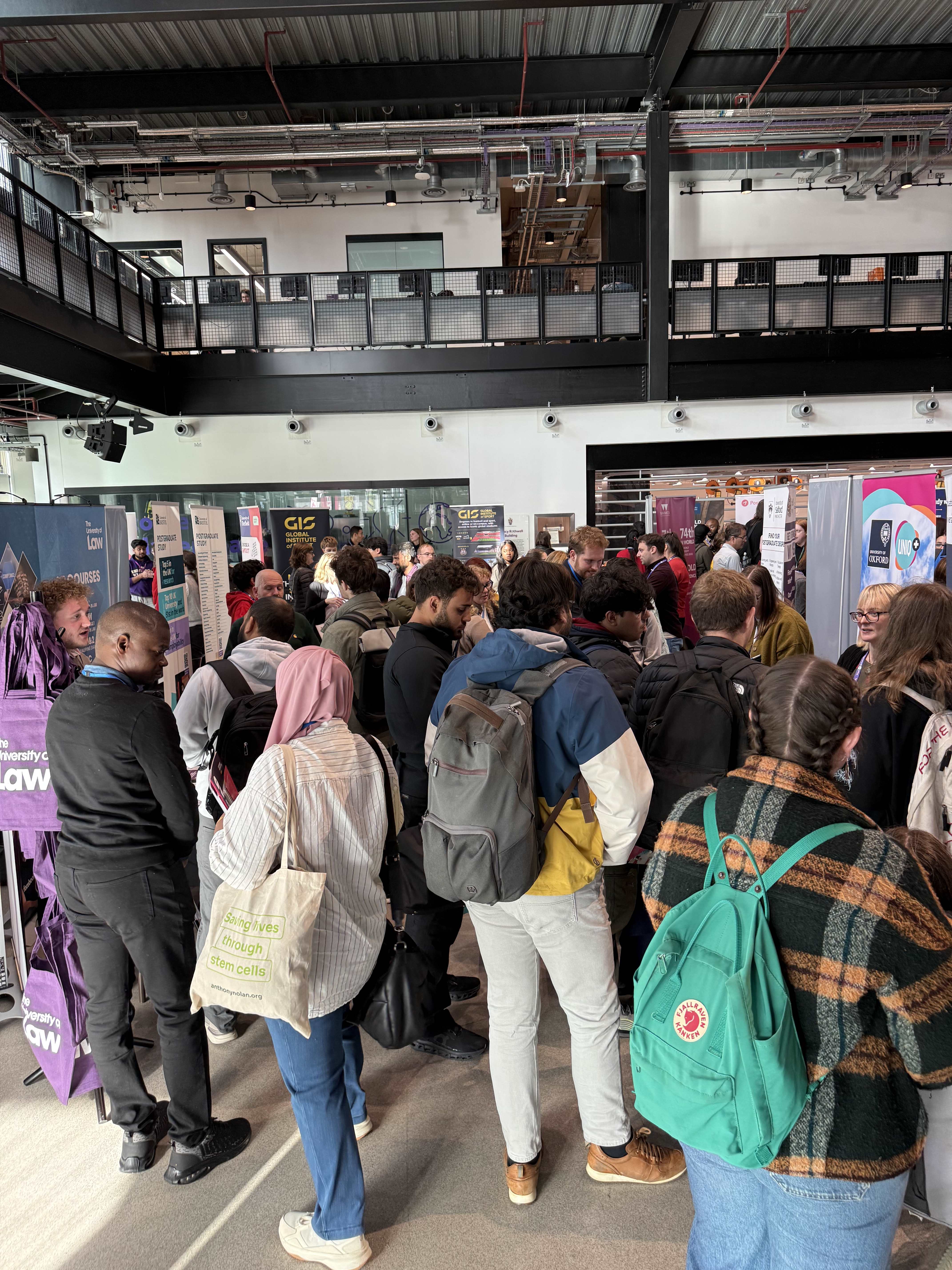 Students visiting university stands at Postgrad LIVE