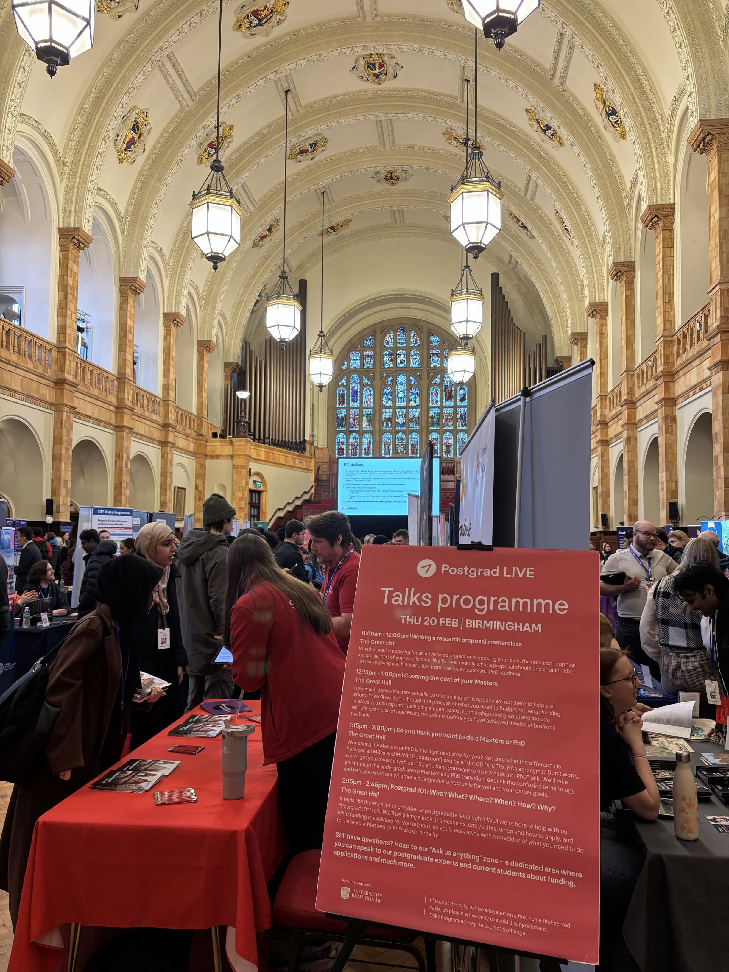Students visiting university stands at Postgrad LIVE