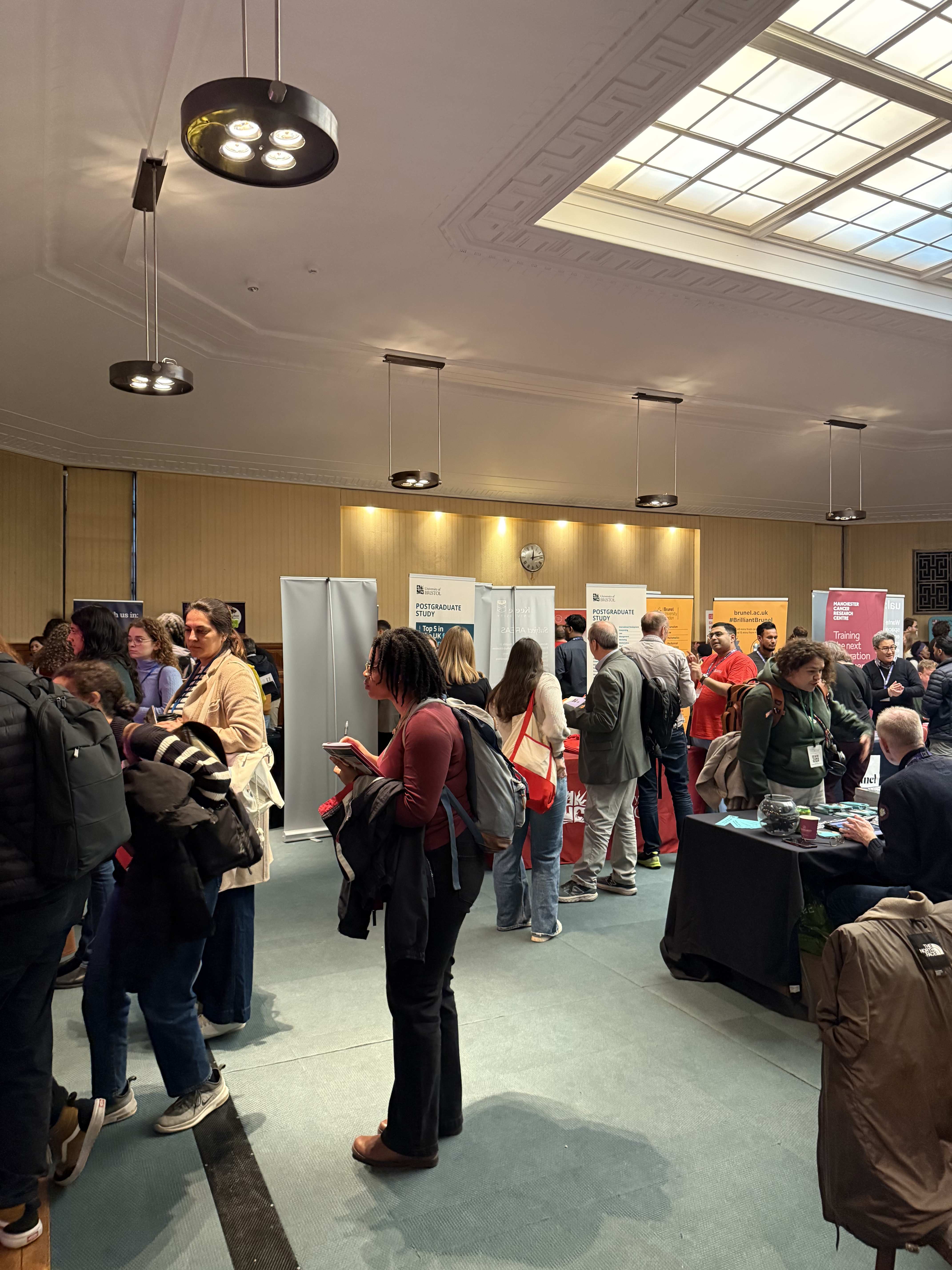Students visiting university stands at Postgrad LIVE