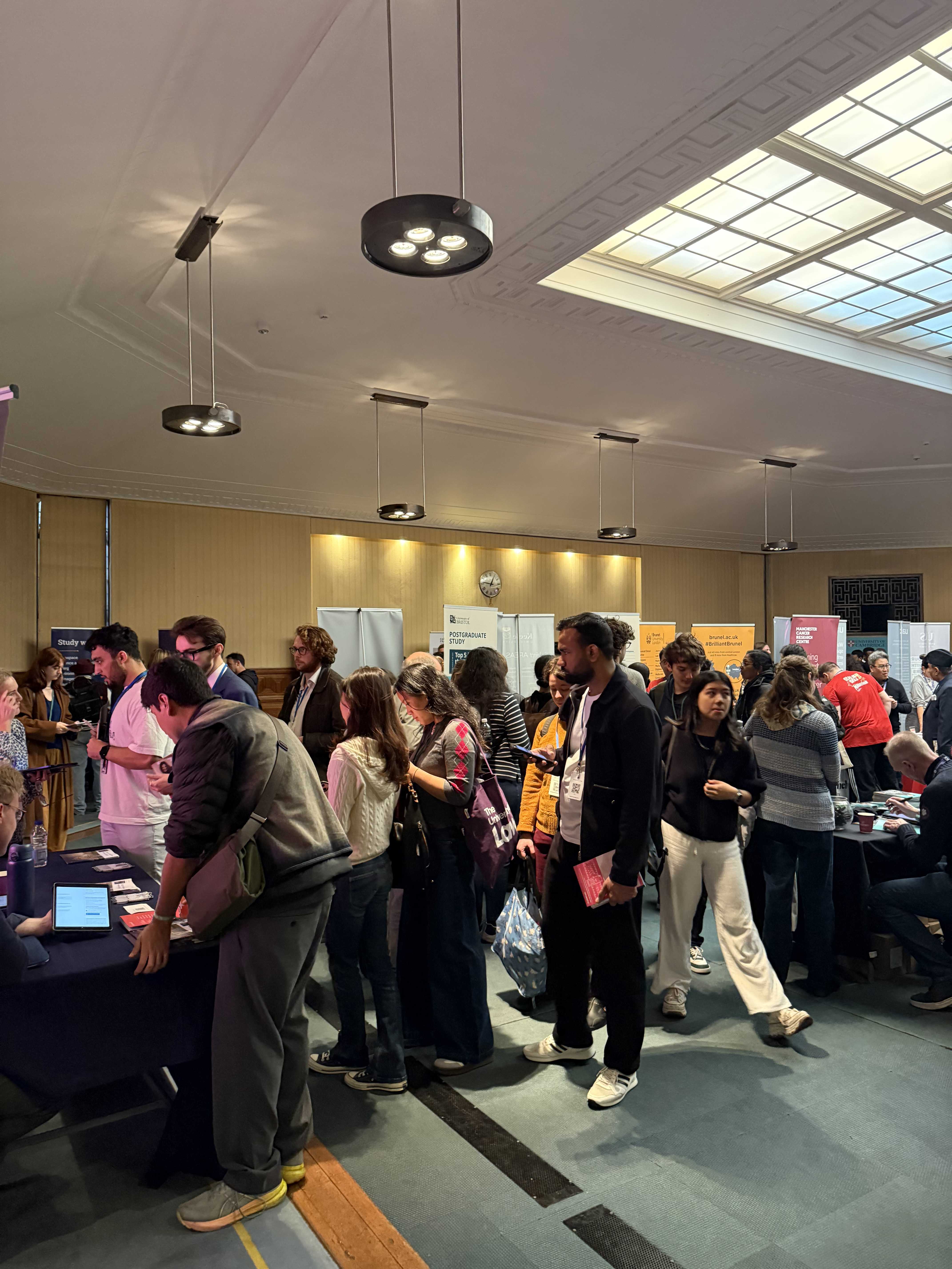 Students visiting university stands at Postgrad LIVE