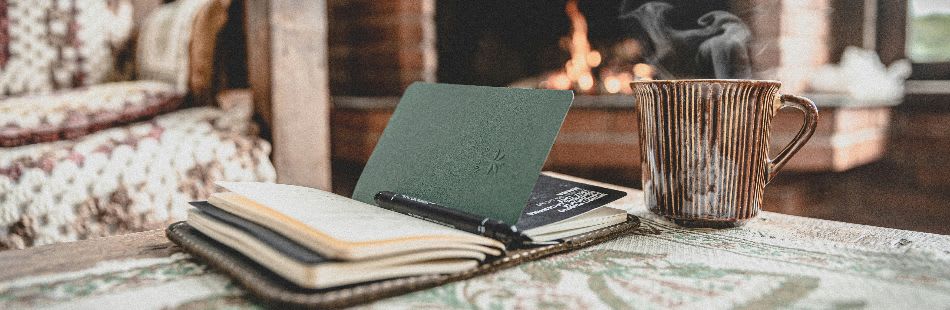 Living room with a book and hot drink on the table