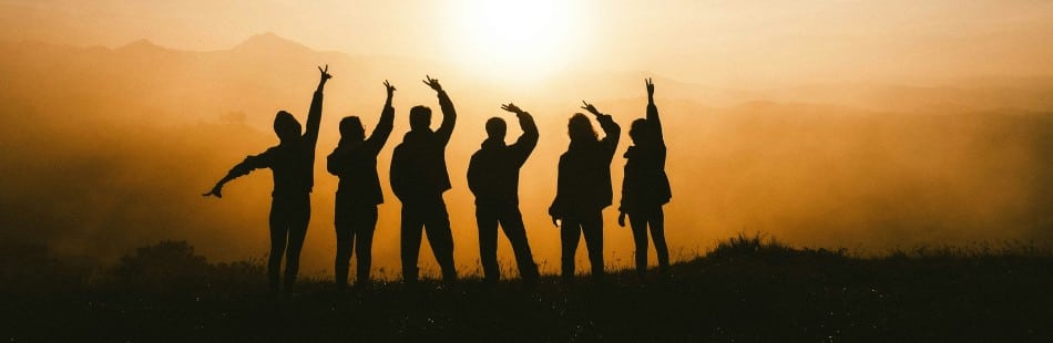 Eight hands placed on top of one another