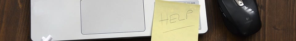 Help sticker on laptop computer