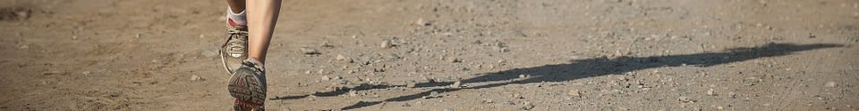 View of a runners ankles and shadow