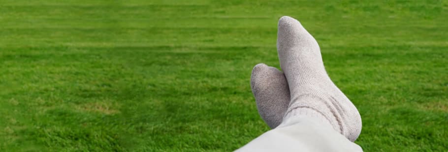 Legs relaxing on grass
