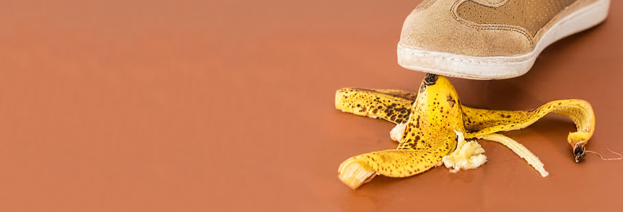 Shoe stepping on banana skin