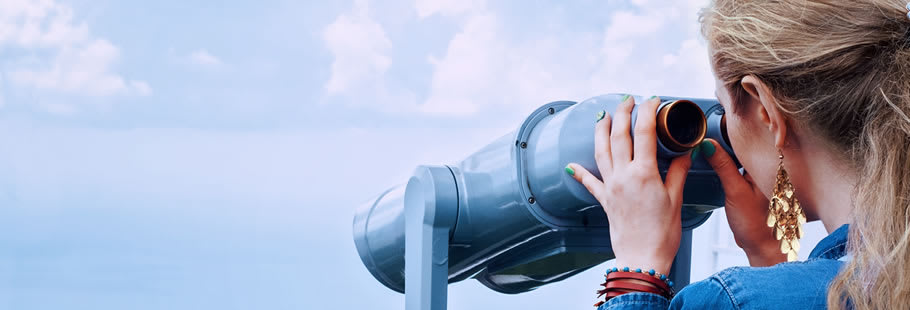 Woman looking through binoculars