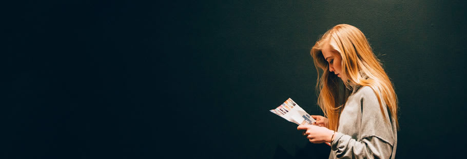 Woman looking at brochure
