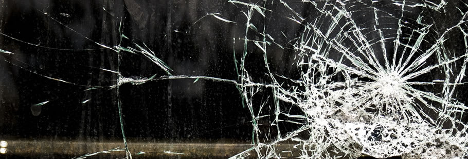 Smashed glass over black background