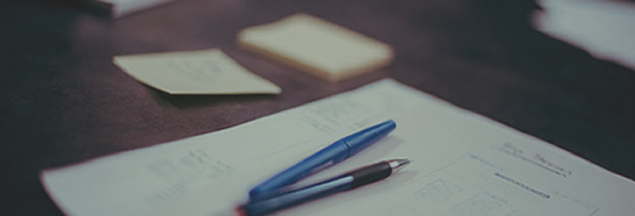 Pens and paper on desk