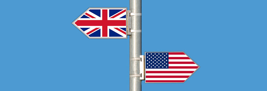 A metal sign showing the union jack pointing to the left and the American flag pointing to the right