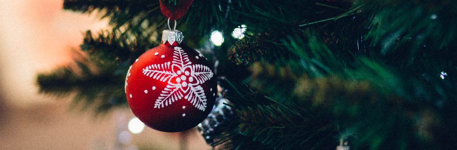 Red bauble on Christmas tree