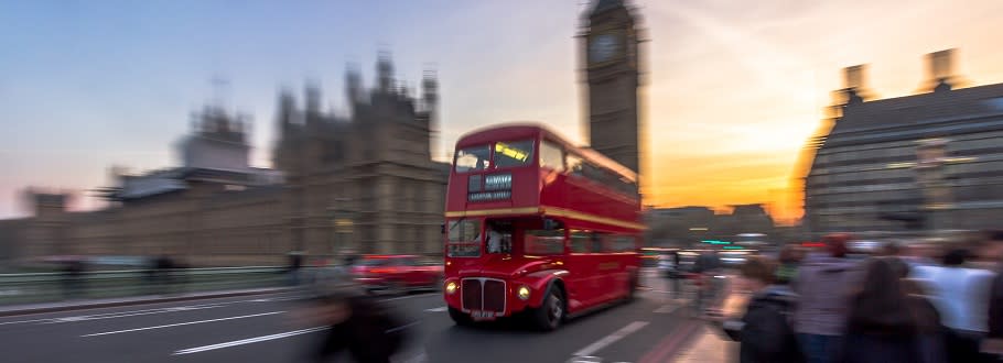 Red bus speeding along London