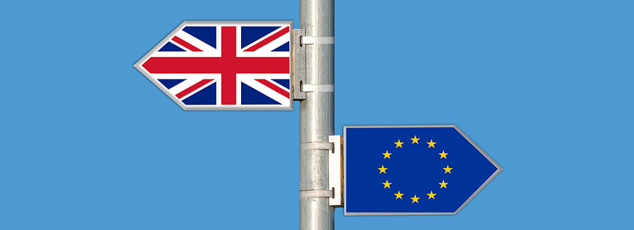 Union Jack and EU flag signs pointing in different directions