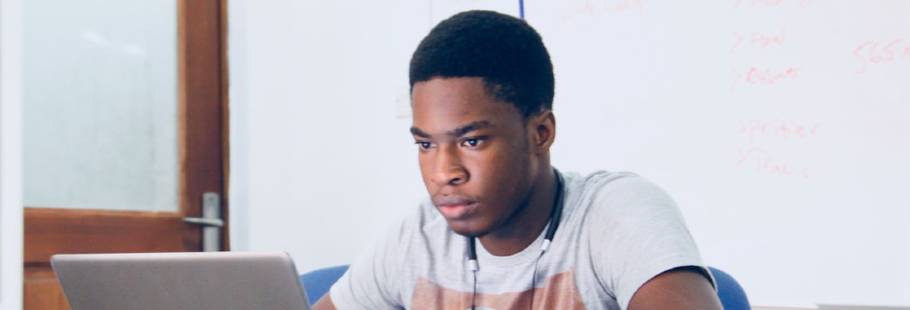 Young man looking at a laptop